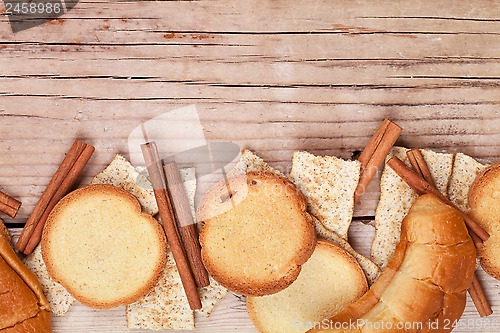 Image of crackers, cinnamon sticks and fresh croissants