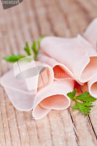 Image of slices of ham with parsley