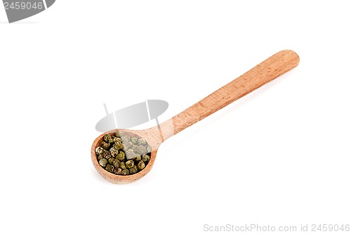 Image of green pepper in wooden spoon