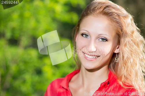 Image of Smiling curly woman