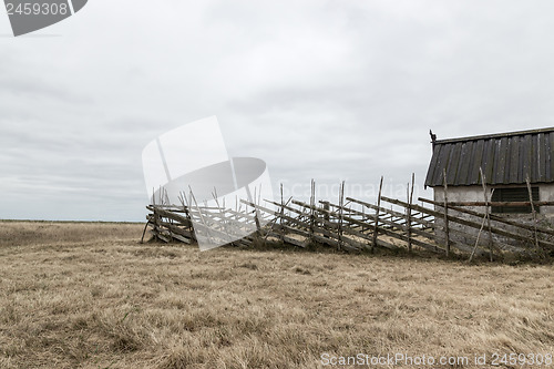 Image of Old barn in the gloomy field