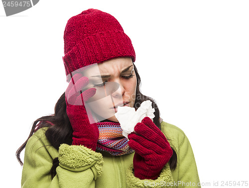 Image of Sick Mixed Race Woman Blowing Her Sore Nose with Tissue
