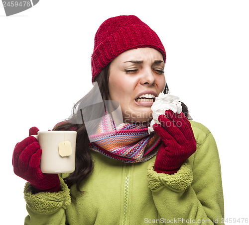Image of Sick Mixed Race Woman Drinks Hot Tea While Blowing Nose 
