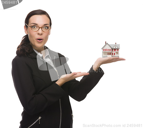 Image of Mixed Race Businesswoman Holding Small House to the Side
