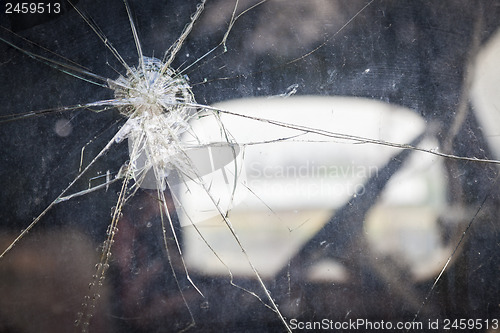 Image of Cracked Window Glass on Antique Truck Abstract
