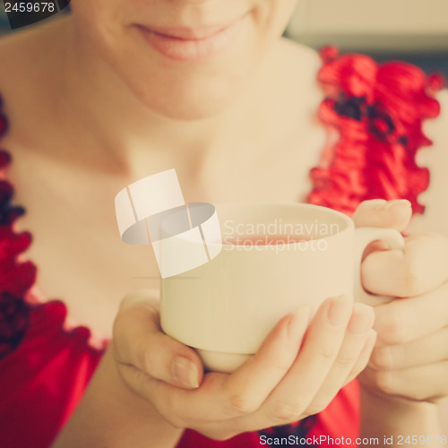 Image of Female Hands Holding A Cup