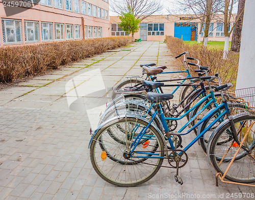 Image of Five Old Bikes Leaning On The Street