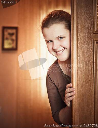 Image of Girl Opening Door