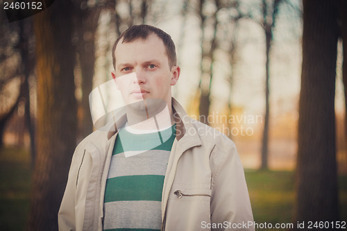 Image of Headshot Of A Young Man Looking At Camera In Park