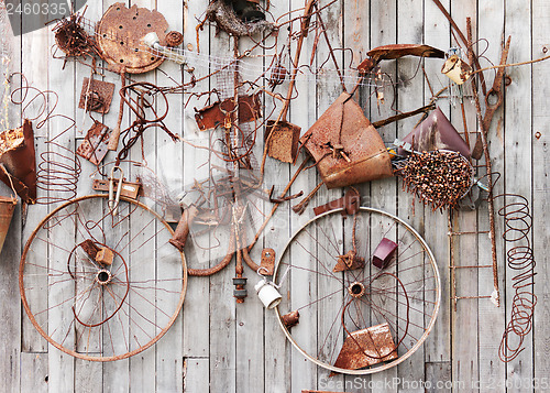 Image of Still-life of rusty metal items on wooden background.