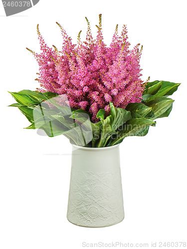 Image of Colorful bouquet from astilbe and funkia flowers in vase isolate