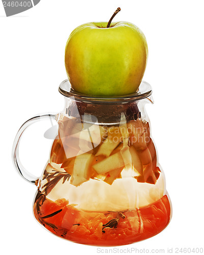 Image of Fruity apple tea in teapot isolated on white background.