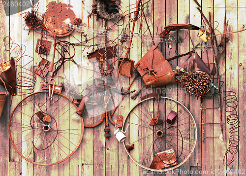 Image of Still-life of rusty metal items on wooden background.