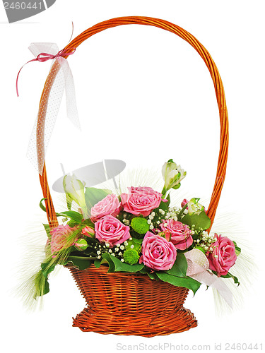 Image of Colorful flower bouquet from roses in wicker basket  isolated on