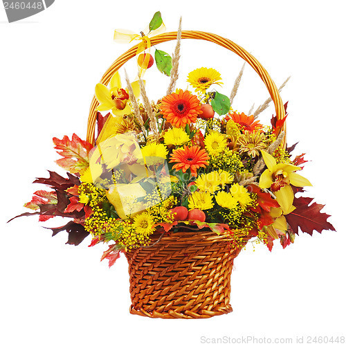 Image of Colorful flower bouquet arrangement centerpiece in wicker basket