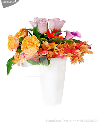 Image of Floral bouquet arrangement centerpiece in white vase isolated on