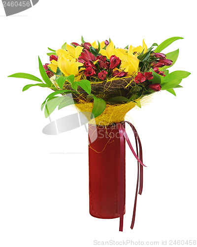 Image of Colorful flower bouquet arrangement centerpiece in red vase isol