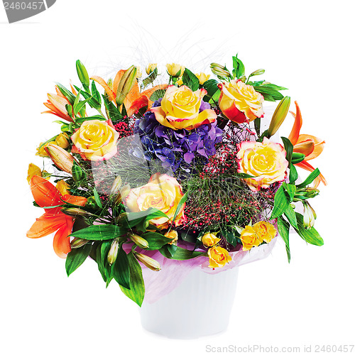 Image of Flower bouquet arrangement centerpiece in vase isolated on white