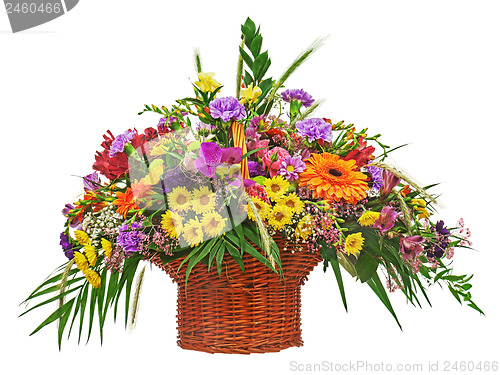 Image of Colorful flower bouquet arrangement centerpiece in wicker basket