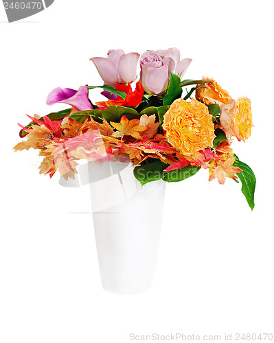 Image of Floral bouquet arrangement centerpiece in white vase isolated on