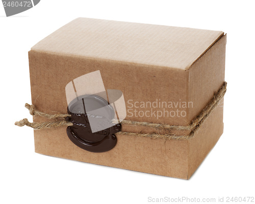 Image of brown cardboard box with stamp isolated on white background 