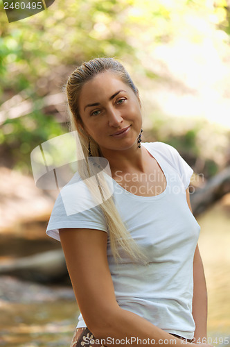 Image of Outdoor fashion portrait of fine woman looking up. 