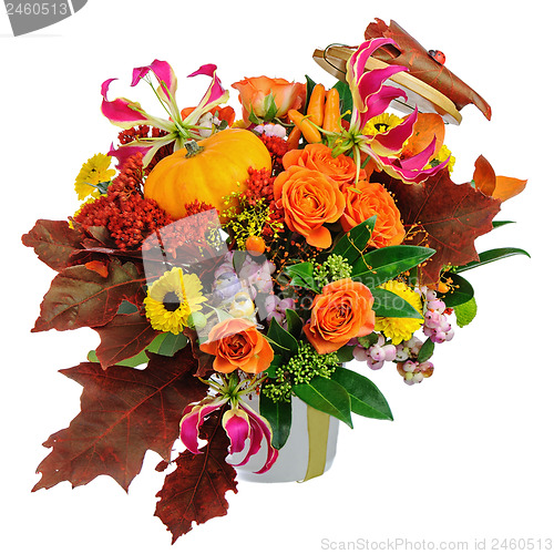 Image of Autumn arrangement of flowers, vegetables and fruits isolated on