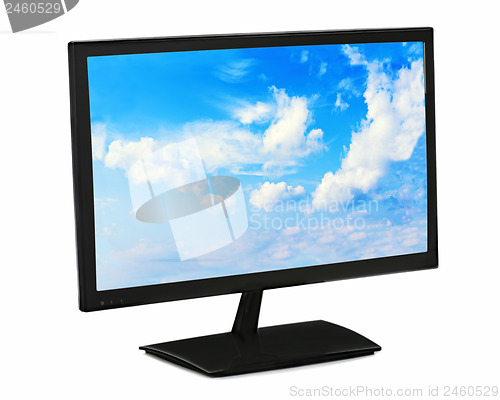 Image of Black lcd monitor with blue sky isolated on white background.