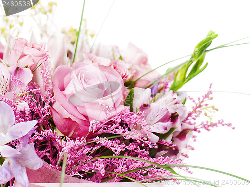 Image of fragment of colorful bouquet of roses, cloves, orchids and frees