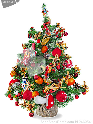 Image of Christmas fir tree decorated with toys and decorations isolated 