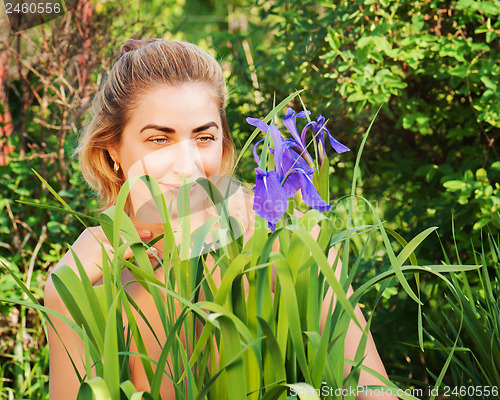 Image of Portrait of young woman in the garden.