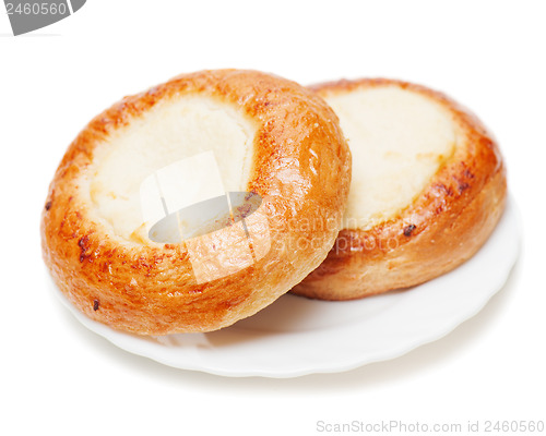 Image of Fresh buns muffins with cottage cheese on white background.
