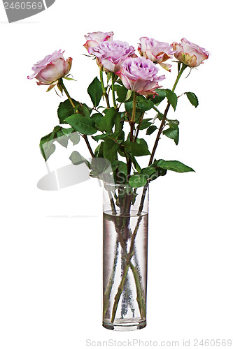 Image of Colorful flower bouquet from roses in glass vase isolated on whi