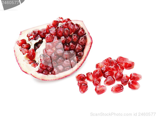 Image of Part of pomegranate fruit isolated on white background. Closeup.