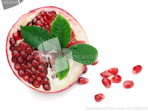 Image of Pomegranate fruit with green leaves isolated on white background