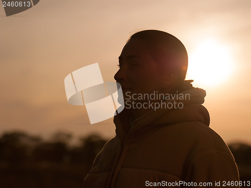 Image of Outdoor fashion closeup portrait of pretty young woman.