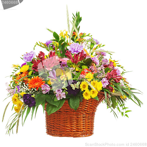 Image of Flower bouquet arrangement centerpiece in wicker basket isolated