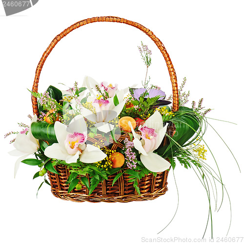 Image of Bouquet from orchids in in wicker basket isolated on white backg