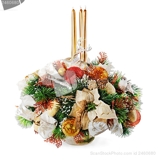 Image of Christmas arrangement of Christmas balls, snowflakes, candles an
