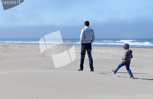 Image of family in sand dunes