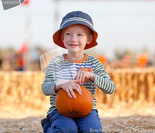 Image of kid at pumpkin patch