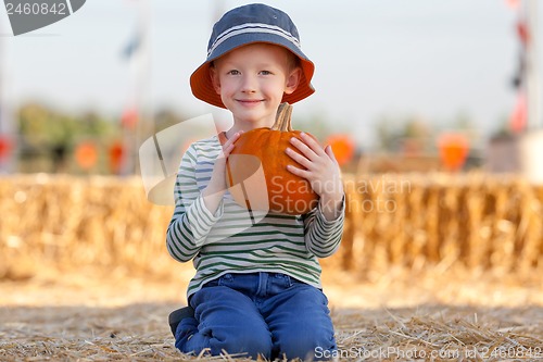 Image of kid at pumpkin patch