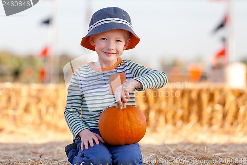 Image of kid at pumpkin patch