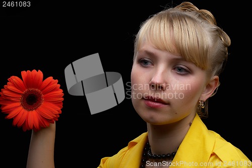Image of beautiful female holding red flower
