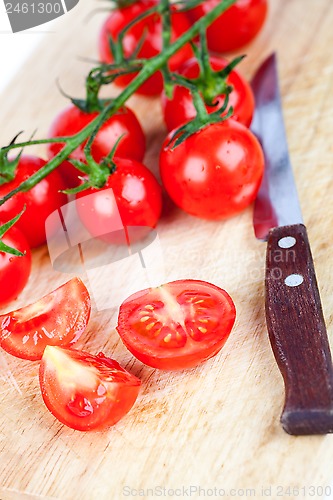 Image of fresh tomatoes and old knife