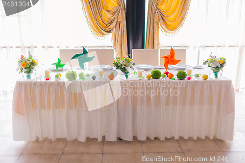 Image of tables decorated with flowers and fruit