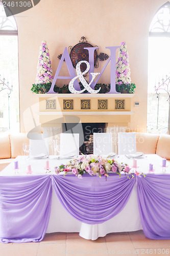 Image of Bride and groom's table decorated with flowers