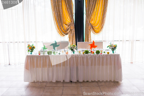 Image of tables decorated with flowers and fruit