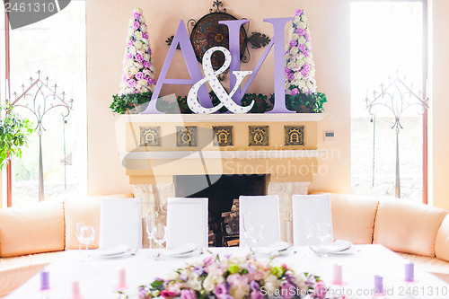 Image of Bride and groom's table decorated with flowers