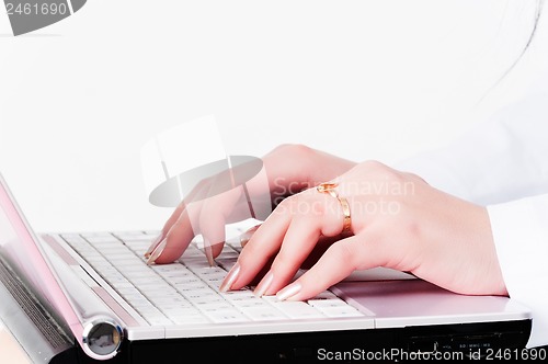 Image of woman's  hands on laptop